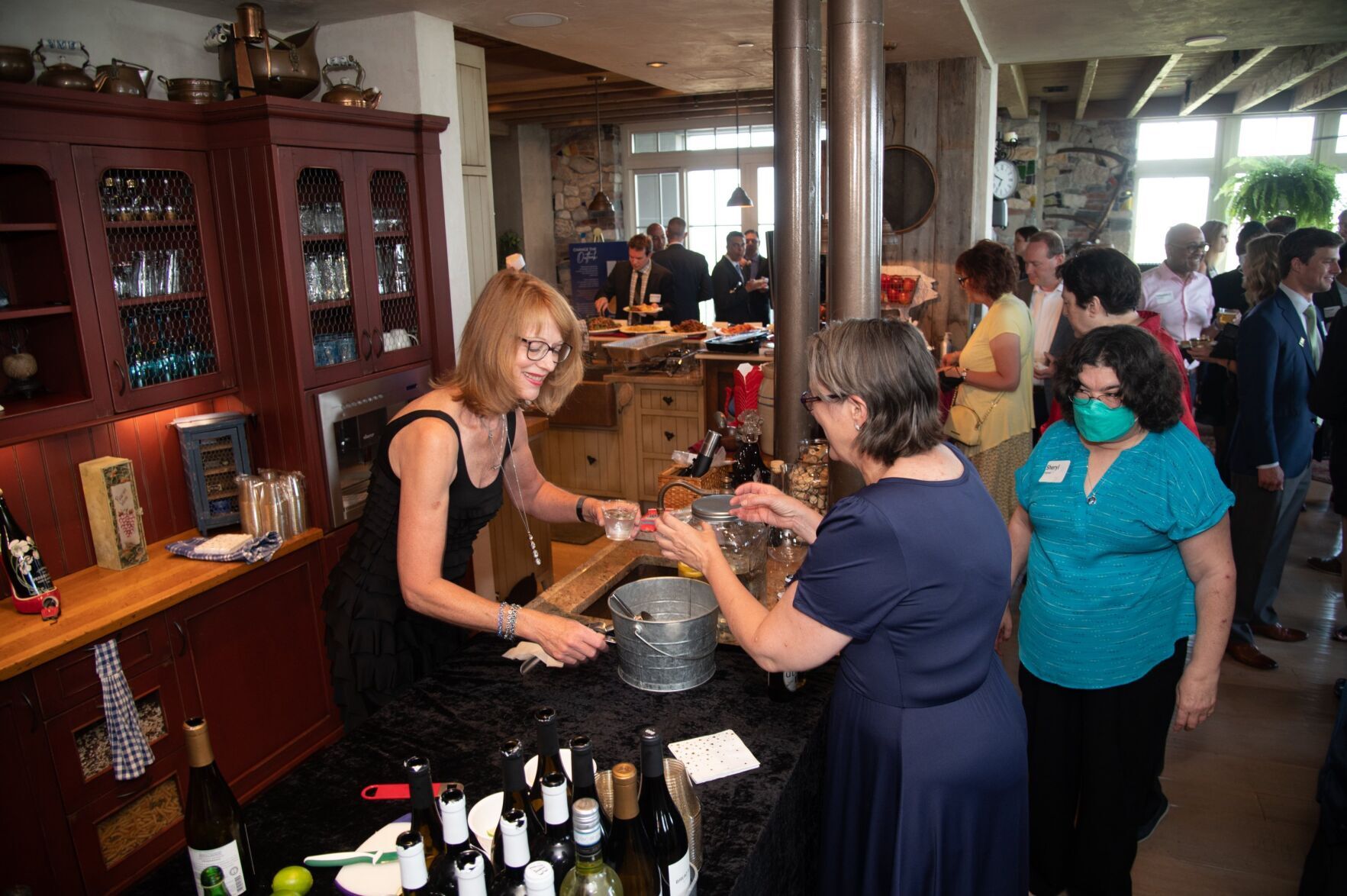 Guests grab a drink at the bar during Vistas and Visionaries